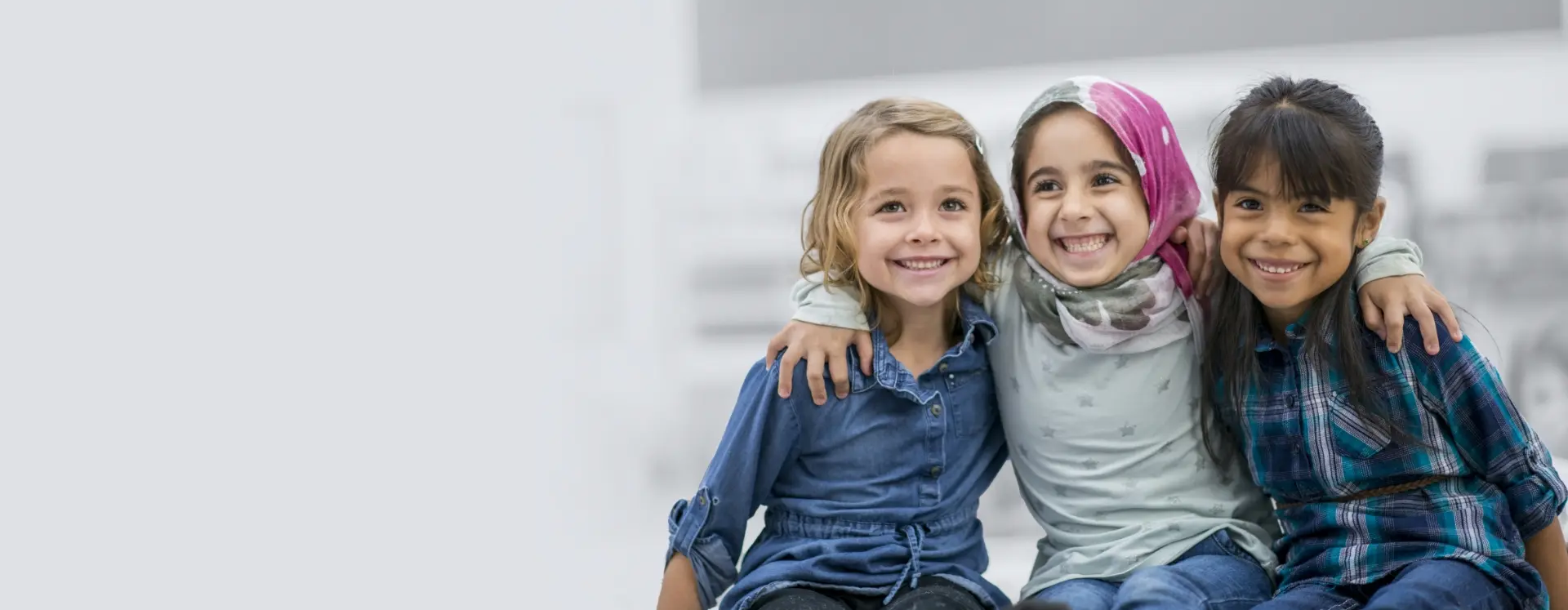 Three children posing together